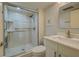 Updated bathroom with walk-in shower and modern vanity at 201 Woodland Dr # 201, Osprey, FL 34229