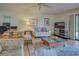 Comfortable living room with tiled floors, seating area, and a large TV at 201 Woodland Dr # 201, Osprey, FL 34229