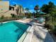 Sparkling community pool with plenty of lounge chairs at 201 Woodland Dr # 201, Osprey, FL 34229