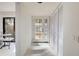Bright entryway with tile floors and built-in storage at 201 Woodland Dr # 201, Osprey, FL 34229