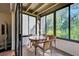 Relaxing sunroom with wicker furniture and ample natural light at 201 Woodland Dr # 201, Osprey, FL 34229