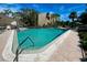 Relaxing community pool with patio and building view at 201 Woodland Dr # 201, Osprey, FL 34229