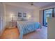 Relaxing bedroom with a ceiling fan and tile floors at 201 Woodland Dr # 201, Osprey, FL 34229