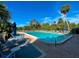 Inviting community swimming pool with lounge chairs at 201 Woodland Dr # 201, Osprey, FL 34229