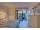 Bedroom with tiled floors and access to a private patio at 201 Woodland Dr # 201, Osprey, FL 34229