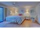 Comfortable bedroom with patio access and wicker chair at 201 Woodland Dr # 201, Osprey, FL 34229