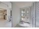 Bright entryway with tile floors and built-in storage at 201 Woodland Dr # 201, Osprey, FL 34229