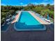 Inviting community pool with plenty of lounge chairs at 201 Woodland Dr # 201, Osprey, FL 34229