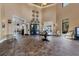 Elegant clubhouse lobby with a wine display and seating area at 10780 Tarflower Dr # 102, Venice, FL 34293