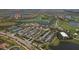 Aerial view of community with clubhouse, pool, and parking at 10780 Tarflower Dr # 102, Venice, FL 34293