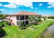 Aerial view of a charming house with a lake view at 10780 Tarflower Dr # 102, Venice, FL 34293