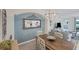 Dining room with a large mirror and a wooden table set at 10780 Tarflower Dr # 102, Venice, FL 34293