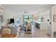 Open living space with kitchen, water view, and comfortable seating at 10780 Tarflower Dr # 102, Venice, FL 34293