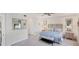 Spacious Primary bedroom with king-size bed and ensuite bathroom at 10780 Tarflower Dr # 102, Venice, FL 34293
