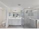 Modern bathroom with a large walk-in shower and double vanity at 10780 Tarflower Dr # 102, Venice, FL 34293