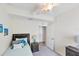 Bedroom with a full-size bed, nightstand and ocean-themed decor at 10780 Tarflower Dr # 102, Venice, FL 34293
