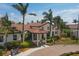 Attractive community entrance with landscaping and a covered area at 10780 Tarflower Dr # 102, Venice, FL 34293