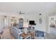 Bright and airy living room featuring comfortable sofas and a flat-screen TV at 10780 Tarflower Dr # 102, Venice, FL 34293