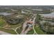 Aerial view of community entrance with gate and landscaping at 10780 Tarflower Dr # 102, Venice, FL 34293