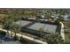 Aerial view of tennis and pickleball courts with players at 10780 Tarflower Dr # 102, Venice, FL 34293