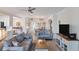Open living room with light blue sofas and a neutral color scheme at 10780 Tarflower Dr # 102, Venice, FL 34293