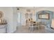 Elegant dining room with a chandelier and a wood table at 10780 Tarflower Dr # 102, Venice, FL 34293