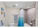 Updated bathroom with a shower/tub, gray tile, and white vanity at 10780 Tarflower Dr # 102, Venice, FL 34293