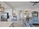 Open concept kitchen with white cabinets and stainless steel appliances at 10780 Tarflower Dr # 102, Venice, FL 34293