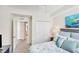 Guest bedroom with a queen-size bed and access to a bathroom at 10780 Tarflower Dr # 102, Venice, FL 34293