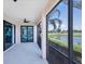 Bright screened porch with access to the living room and lake view at 10780 Tarflower Dr # 102, Venice, FL 34293