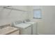 Laundry room with washer, dryer, and utility sink at 24273 Spartina Dr, Venice, FL 34293