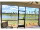 Enjoy the lake view from this screened porch at 24273 Spartina Dr, Venice, FL 34293