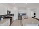 Modern kitchen with stainless steel appliances at 24273 Spartina Dr, Venice, FL 34293