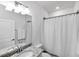 Clean bathroom with granite countertop, single sink, and shower/tub combo at 24273 Spartina Dr, Venice, FL 34293