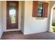 Front entry with decorative door and welcome mat at 24273 Spartina Dr, Venice, FL 34293
