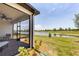 Screened porch overlooking a tranquil lake at 24273 Spartina Dr, Venice, FL 34293