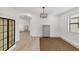 Bright dining room with modern light fixture and area rug at 24273 Spartina Dr, Venice, FL 34293