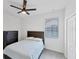 Cozy bedroom with ceiling fan and neutral decor at 24273 Spartina Dr, Venice, FL 34293