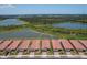 Aerial view of houses near a lake at 24273 Spartina Dr, Venice, FL 34293