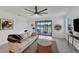 Bright living room with sliding glass doors to backyard at 24273 Spartina Dr, Venice, FL 34293