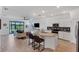 Open concept kitchen features granite countertops and island at 24273 Spartina Dr, Venice, FL 34293