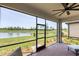 Spacious screened porch with lake view and ceiling fan at 24273 Spartina Dr, Venice, FL 34293