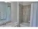 Simple bathroom with granite countertop, single sink, and shower/tub combo at 24273 Spartina Dr, Venice, FL 34293