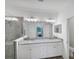Elegant bathroom with granite countertops, double sinks, and a large shower at 24273 Spartina Dr, Venice, FL 34293