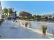 Community patio area with tables, chairs, and lake views at 1403 Gondola Park Dr # 1403Bd, Venice, FL 34292