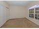 Bedroom with double doors and large window with an outdoor view at 1403 Gondola Park Dr # 1403Bd, Venice, FL 34292