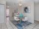 Elegant dining area with glass table and chairs at 1403 Gondola Park Dr # 1403Bd, Venice, FL 34292