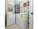 Bright laundry room with washer and dryer, and extra shelving at 1403 Gondola Park Dr # 1403Bd, Venice, FL 34292
