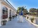 Relaxing community patio with seating and potted plants at 1403 Gondola Park Dr # 1403Bd, Venice, FL 34292