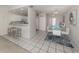 Open concept dining area with kitchen view at 1403 Gondola Park Dr # 1403Bd, Venice, FL 34292